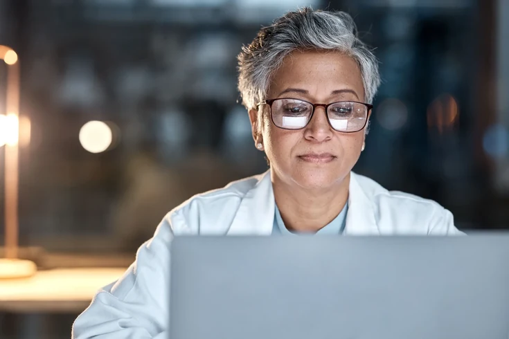 Recruitment manager working on a laptop